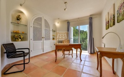 A beautiful villa in a peaceful, green setting.